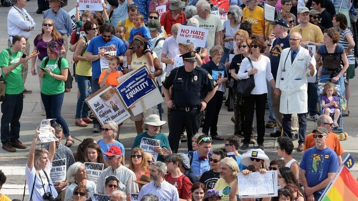 Protesters head into the Legislative building for a sit-in against House Bill 2 in Raleigh, N.C., on April 25, 2016. California has banned publicly funded travel to North Carolina because of that law.