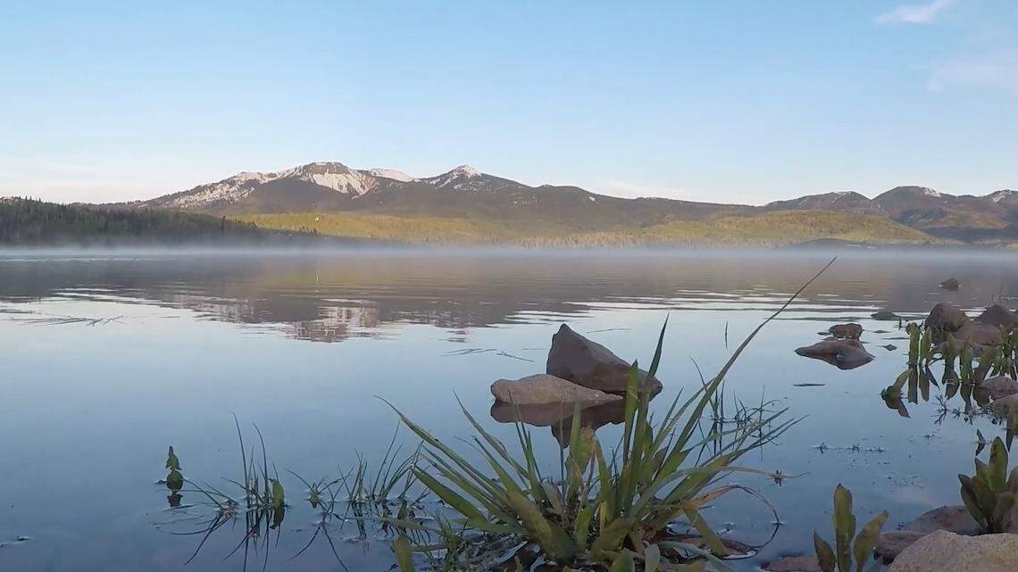 An angler drowned after the boat they were strapped into for safety flipped over on a frigid Colorado lake, officials said.