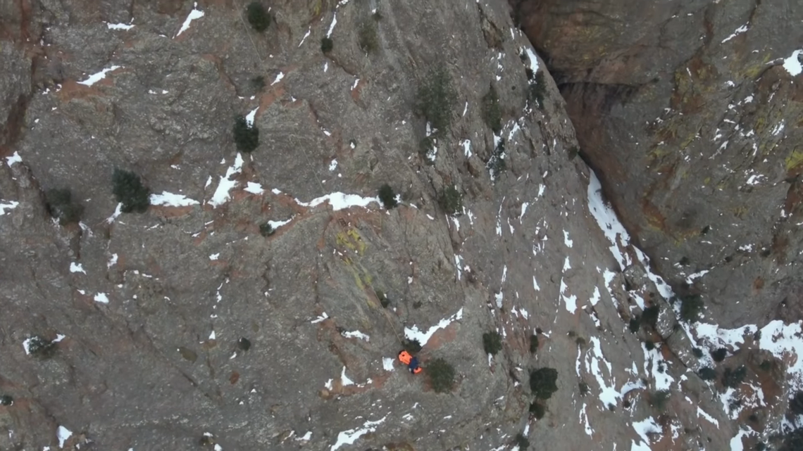 Drone video shows dramatic rescue after frostbitten hiker gets stuck on steep ledge in Colorado canyon.