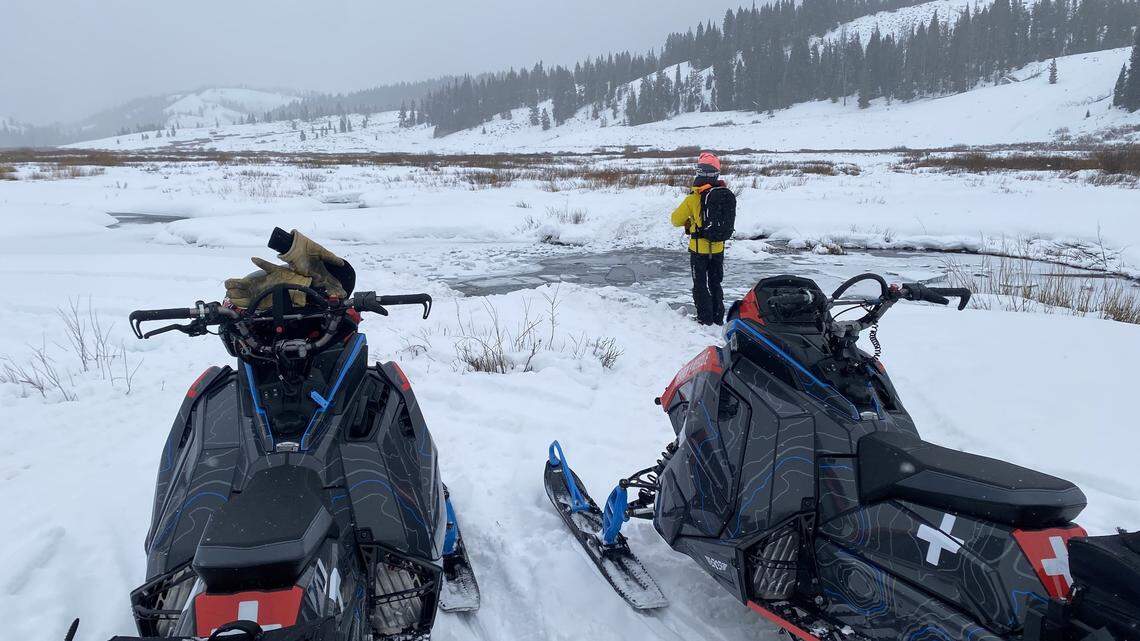 Two riders had to abandon the rented snowmobile they were on when it broke through ice and sank into a beaver pond in Wyoming.