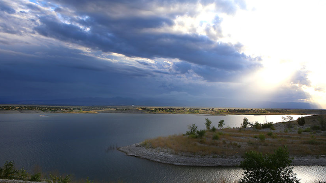 The body of a missing swimmer was found in 6 feet of water in a Colorado lake, rangers said. 