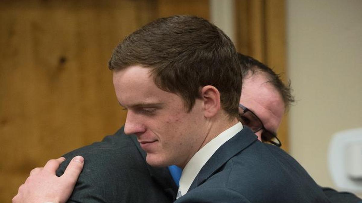 John R.K. Howard (facing left) embraces defense attorney Ira Dillman after his sentencing hearing Friday at the courthouse in Twin Falls.
