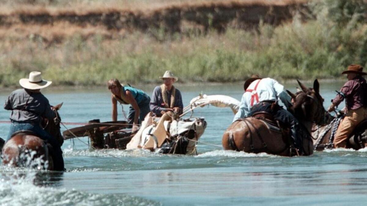 A past crossing, after an ox slipped and fell, pulling a wagon onto its side on a treacherous stretch of the river.