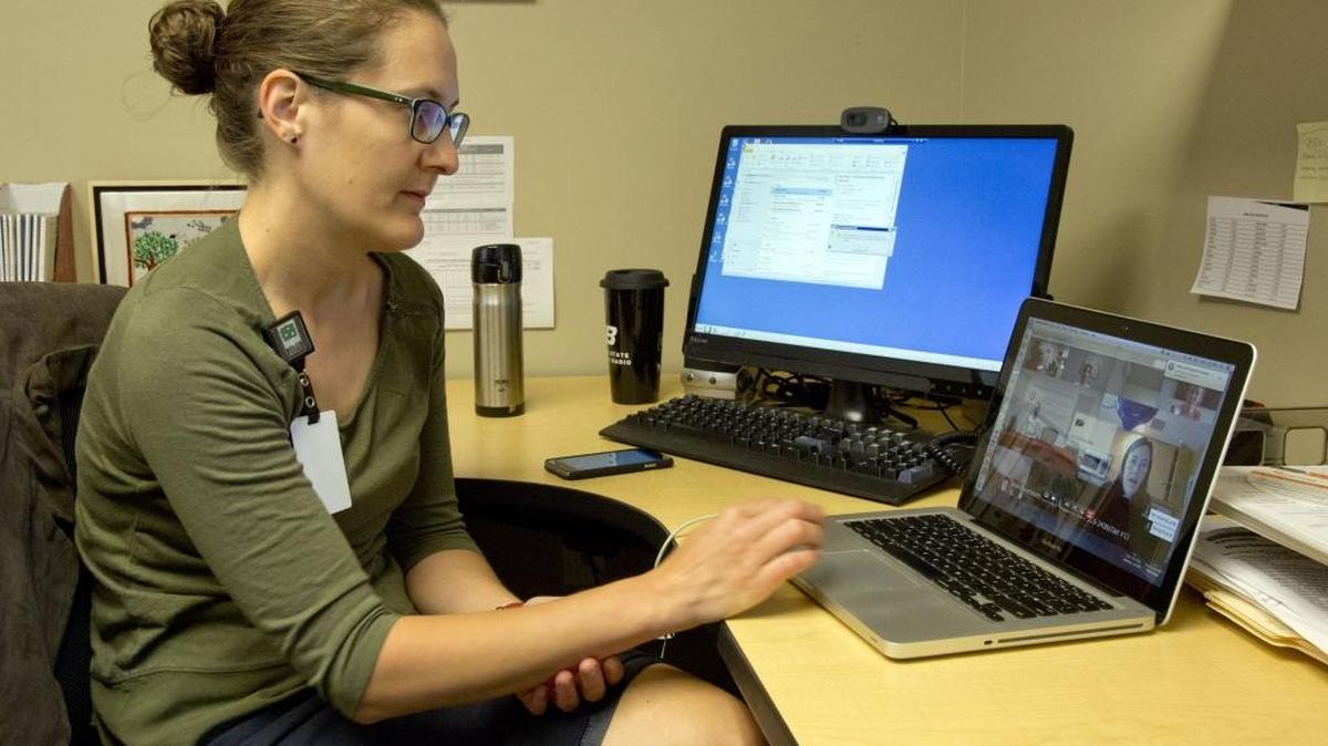 Dr. Magni Hamso, a physician at Terry Reilly Health Services in Boise, joins a weekly videoconference call in which doctors discuss their complex cases with specialists.
