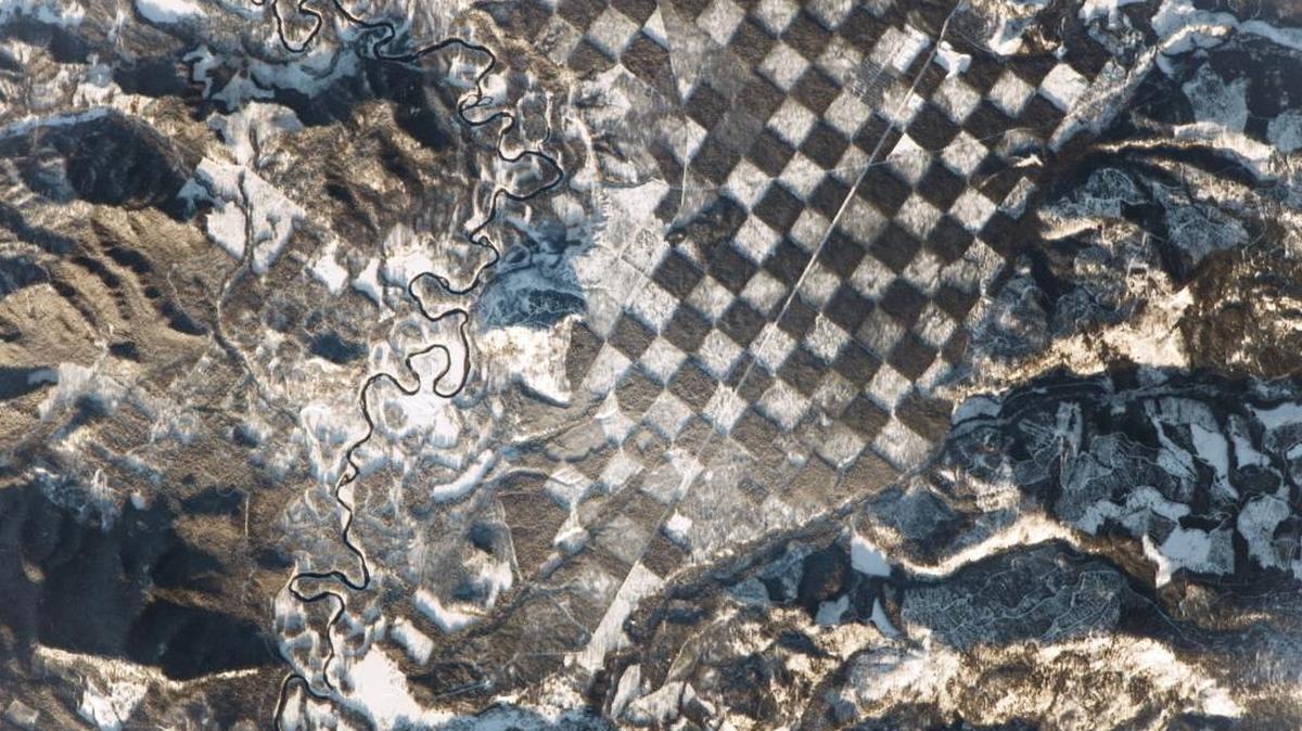 Logging parcels have created a striking checkerboard pattern along the Priest River in northern Idaho, as captured from the International Space Station by a NASA astronaut.