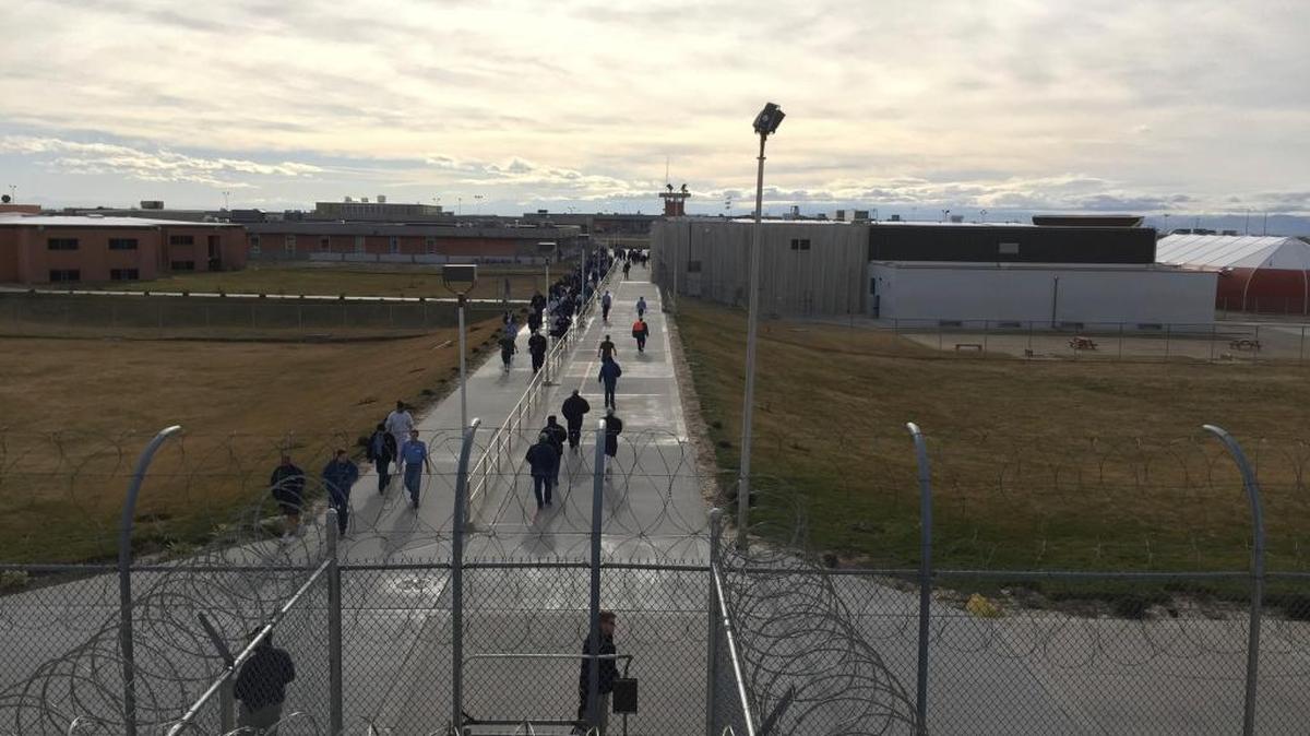 Inmates walk across the grounds of the Idaho State Correctional Institution in Kuna in January 2018. The medium-security prison is one of several in the prison complex south of Boise facing staffing shortages.
