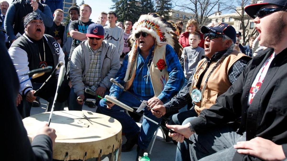 The Shoshone-Paiute Sweet Sage Drum Group performs during the Idaho Territorial Sesquicentennial Commemoration in March 2013 at the Idaho Capitol.