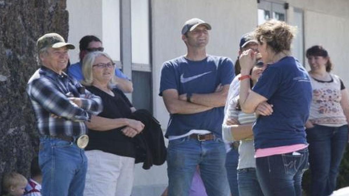 Parents meet at the Church of Jesus Christ of Latter-day Saints to pick up their children on Wednesday in Dietrich, after the town’s school was put on lockdown.