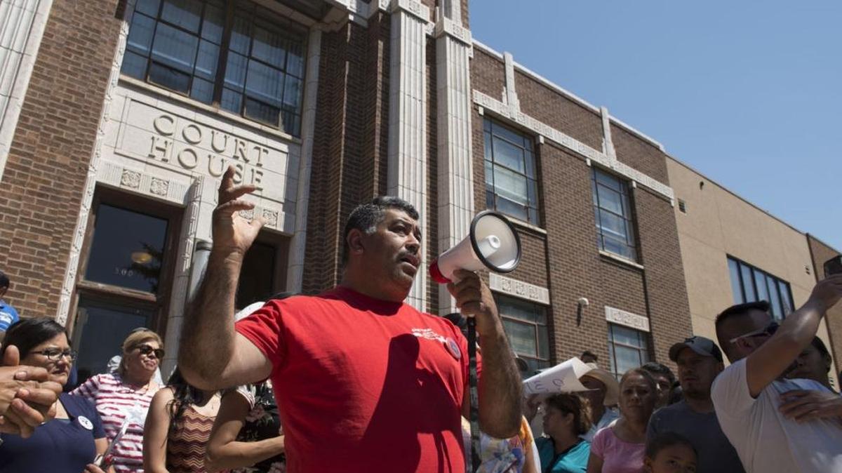 Enrique Sandoval, owner of Cheverria’s in Jerome, speaks to the crowd after a county commissioners meeting concerning a possible contract with Immigration and Customs Enforcement (ICE) Monday afternoon in Jerome. Several hundred protesters showed up with signs and marched to the courthouse for the meeting.