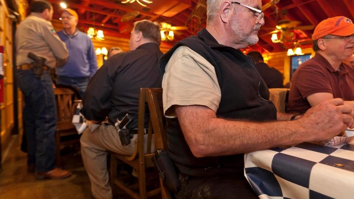 Carrying a Ruger 9mm sidearm, Dan Malloy of Boise attends a meeting of an Idaho open carry organization in February 2013 in Meridian. At the time, Malloy said he carried a weapon openly or concealed most of the time.