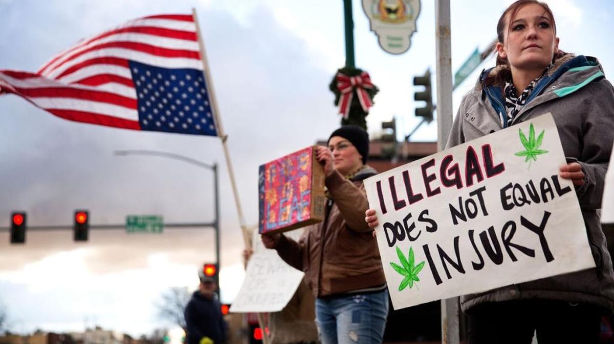 Kelsey Osborne stands with other protesters after her preliminary hearing Tuesday at the Twin Falls County Courthouse in Twin Falls. Osborne is charged with injury of a child after giving her daughter butter infused with marijuana to treat the girl’s seizure-like symptoms.