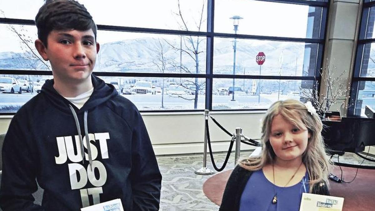 Siblings Auston Svancara, 15, and Melessa Peck, 9, hold some of the grief kits that they and their relatives are donating to Portneuf Medical Center for children who lose their parents. Auston and Melessa lost both parents earlier this year and this is their way to give back to the community.