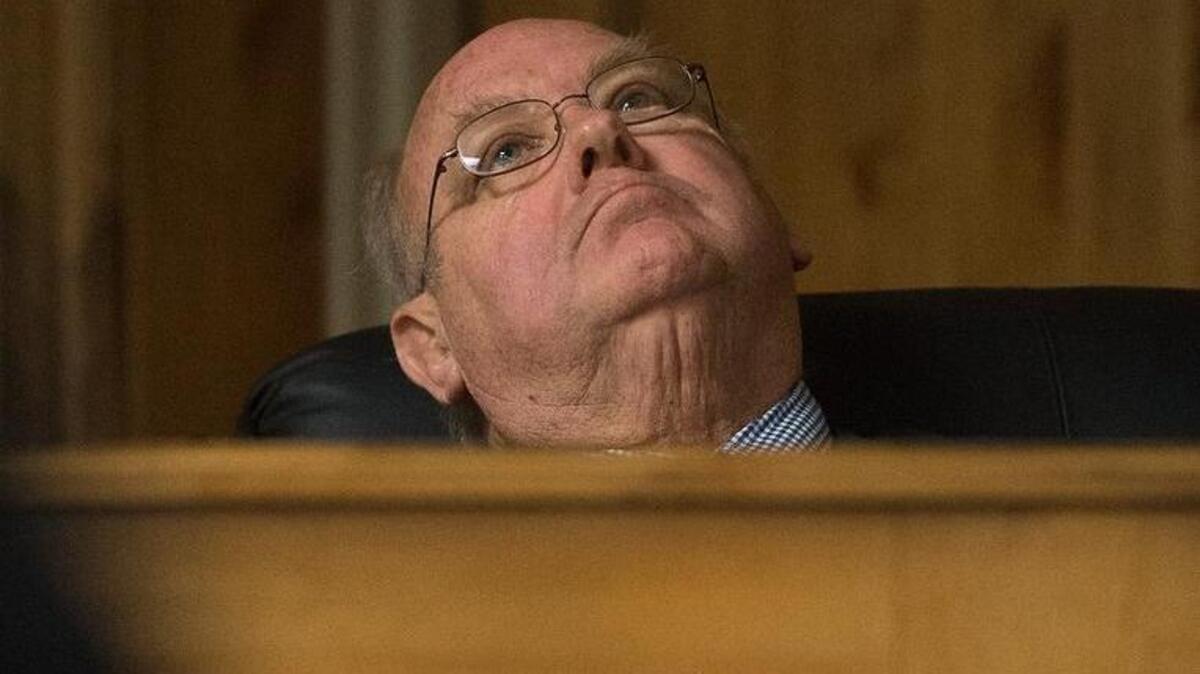 District Judge Randy Stoker listens to John R.K. Howard's defense attorney Brad Calbo during Howard's sentencing hearing earlier in February.