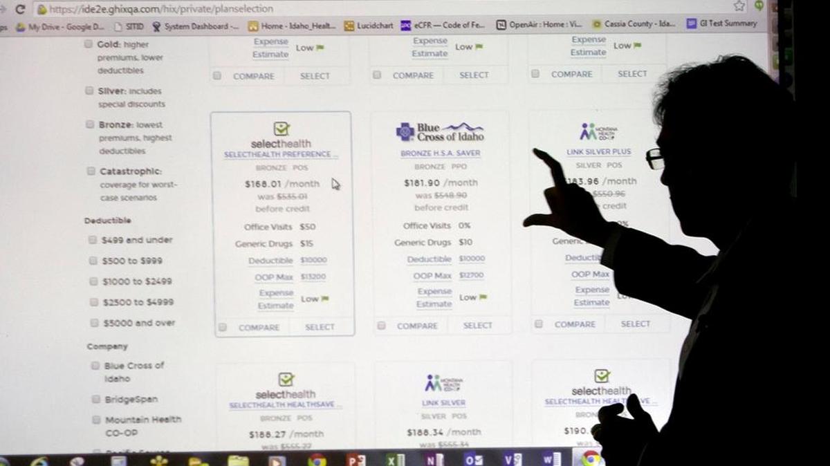 Shankar Srinivasan, with Get Covered, gives a tour of the Your Health Idaho website in November 2014.