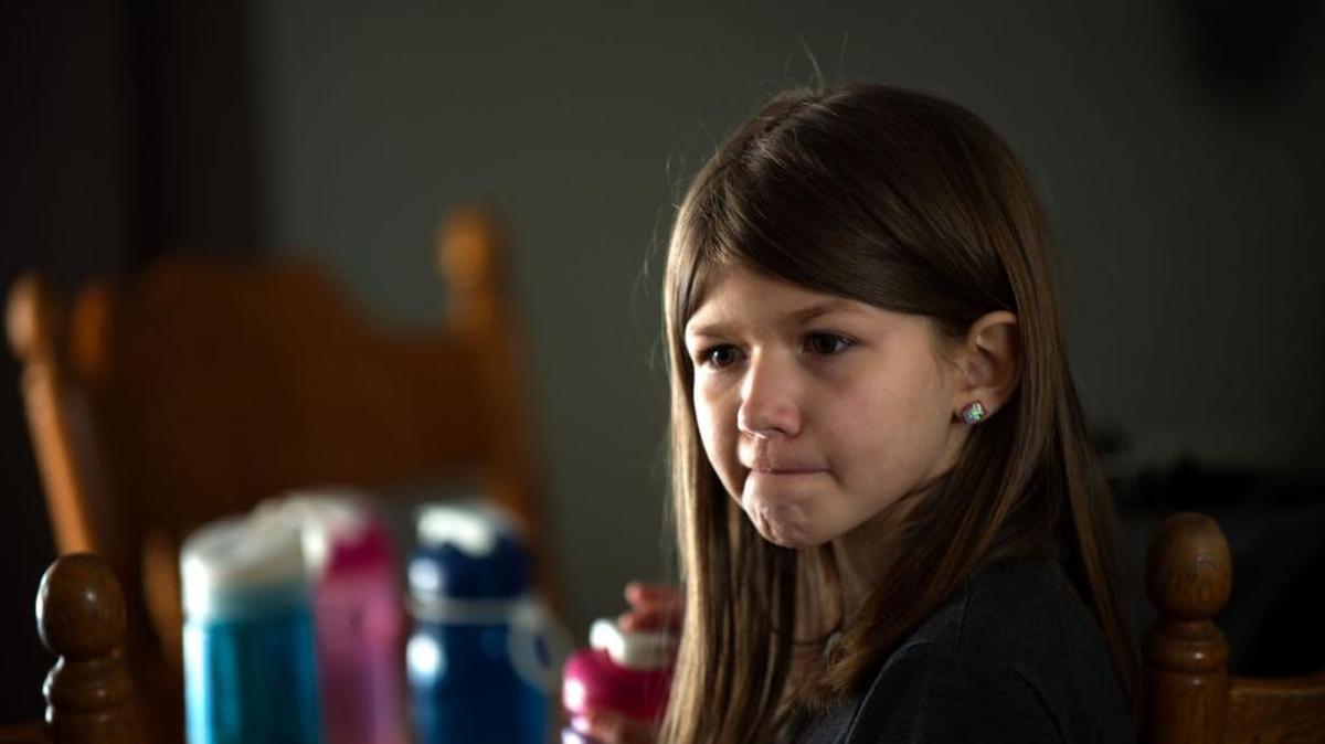 Taren Baker, 9, hangs out in the kitchen with her family Feb. 24. Taren’s biological mother gave up her parental rights, and her Twin Falls foster parents adopted her five years ago. Many people approach foster parenting with the hope of adopting, but the Idaho Department of Health and Welfare’s primary goal is reunifying foster children with biological parents.