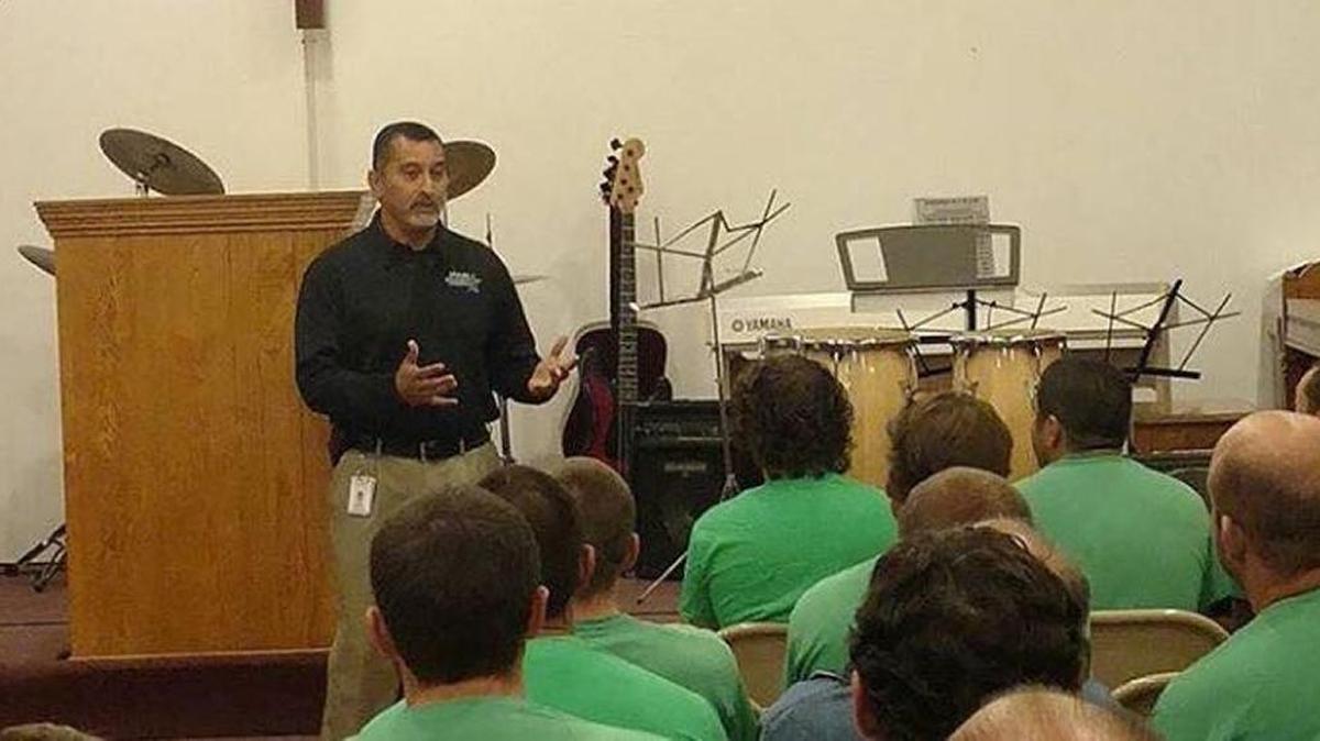 Henry Atencio is pictured here teaching inmates about to go out on parole.