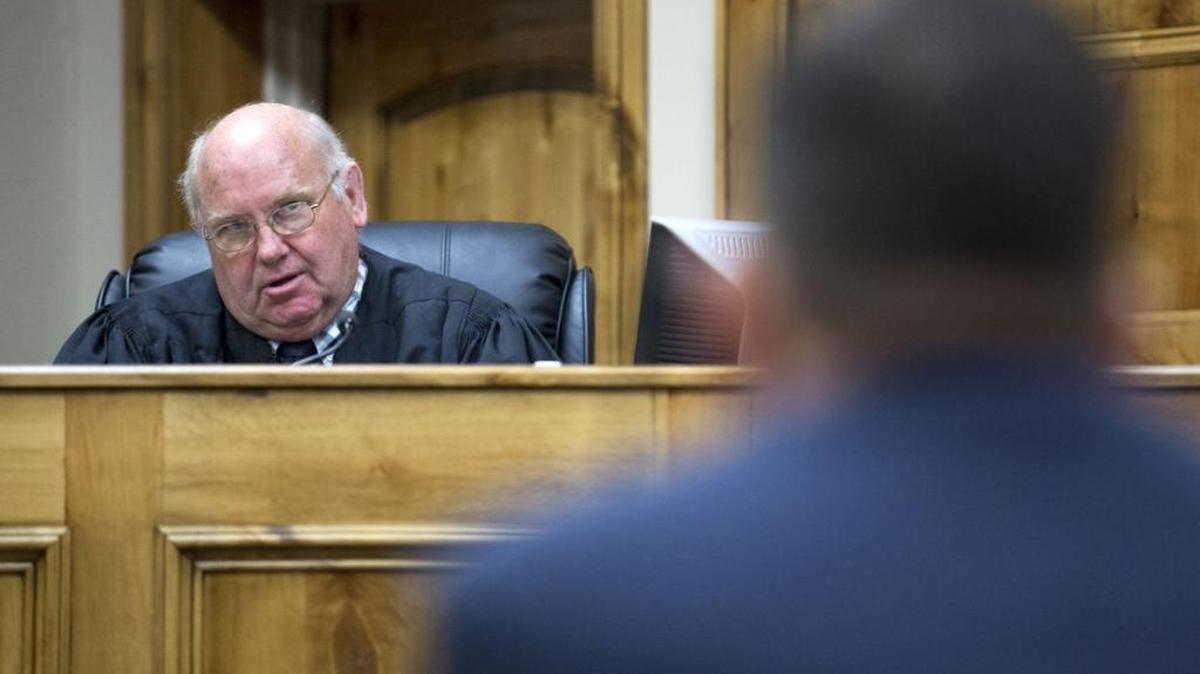 District Judge Randy stoker speaks to a defense attorney on March 17 at the Twin Falls County Courthouse.