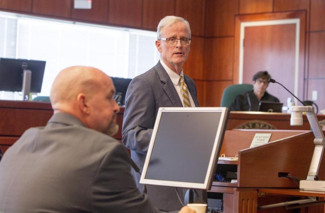 Idaho State Police attorney Andrew Brassey looks toward whistleblower Brandon Eller during trial Monday at the Ada County Courthouse in Boise. Eller claims the Idaho State Police retaliated against him after he raised concerns about the investigation of a fatal crash involving an Idaho sheriff’s deputy.