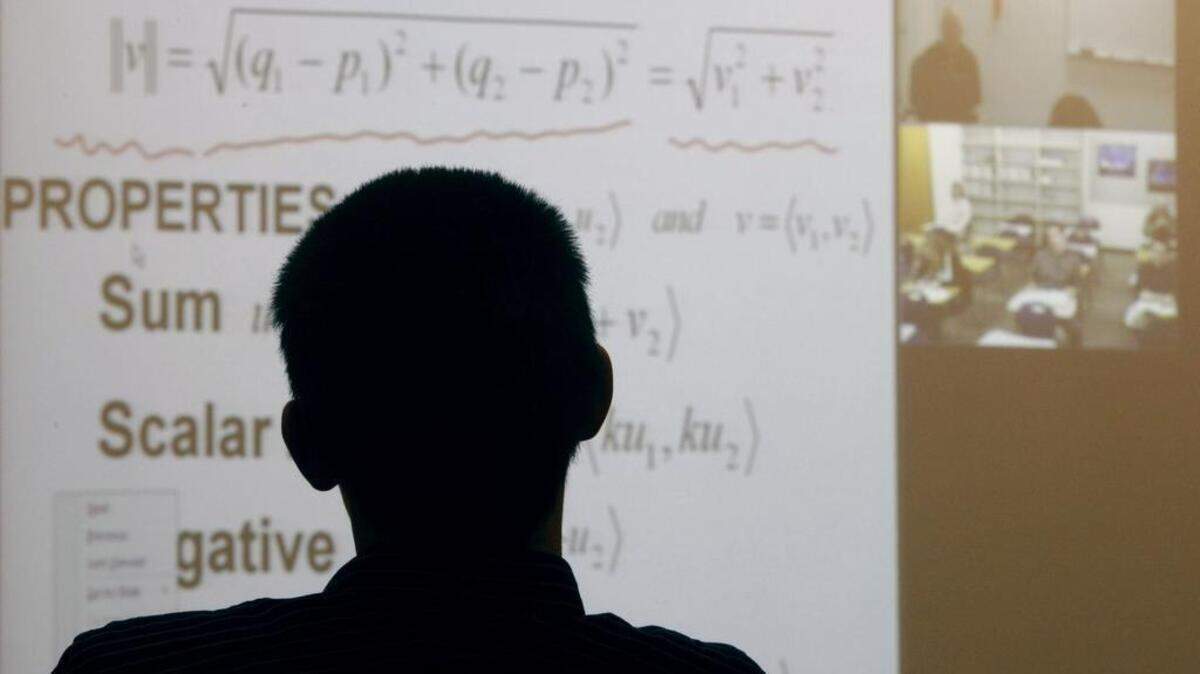 Rocky Mountain High junior Tyler Clark, 16, and two other students attend a Calculus II class taught remotely at Eagle High School via the then-new Idaho Education Network in November 2009.