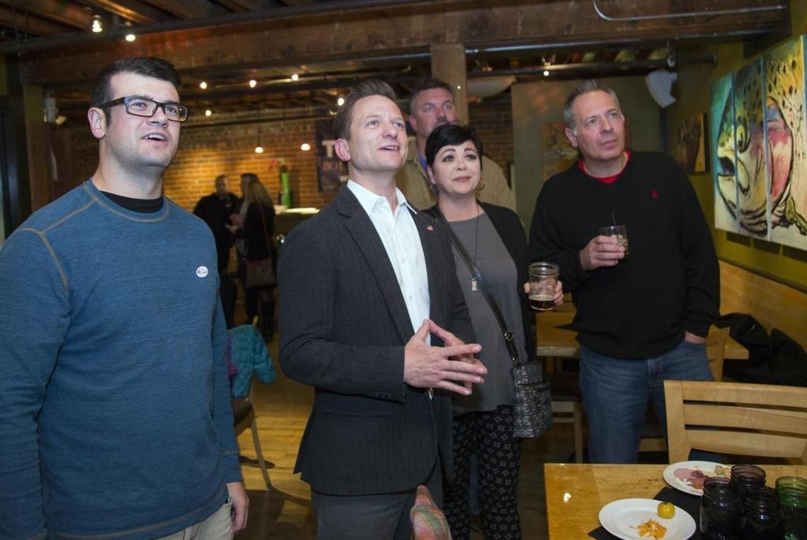 TJ Thomson, center, watches as election results start streaming in at a party for his supporters in November 2017 at Solid Grill & Bar in downtown Boise. Thomson has announced he will not run for re-election in 2021