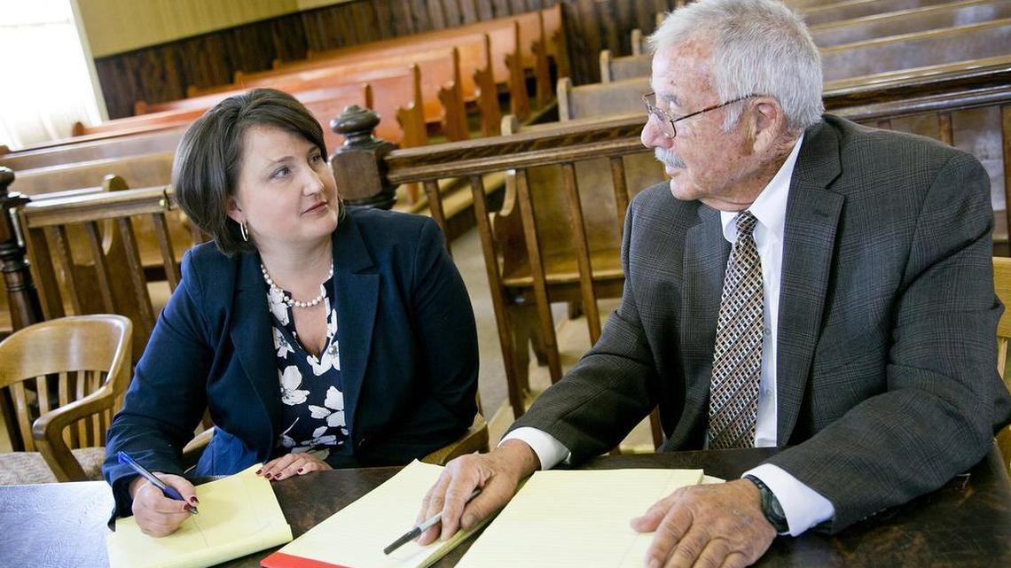 Boise County Prosecutor Jolene Maloney, left, and Chief Deputy Prosecutor Jay Rosenthal talk after a domestic violence preliminary hearing at the Boise County Courthouse last June.