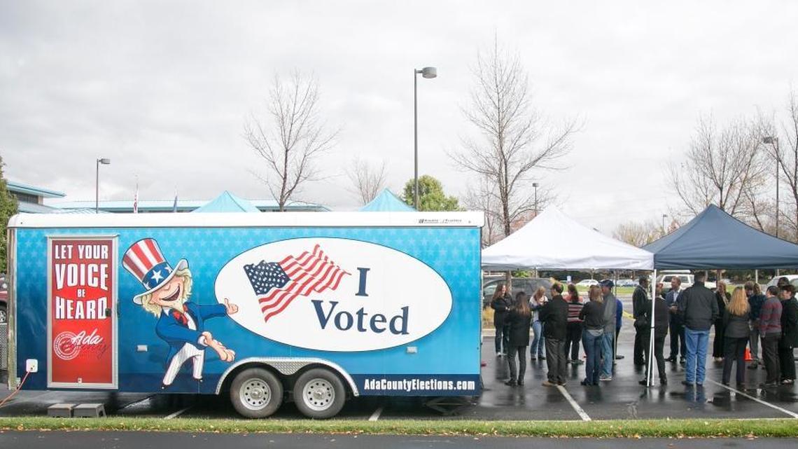 Voters line up to cast their ballots Tuesday, Oct. 18, at Ada County's mobile voting trailer, stationed for the day at Blue Cross of Idaho in Meridian. The “Food Truck” voting trailer is making the rounds to help people vote early through Friday, Nov. 4.