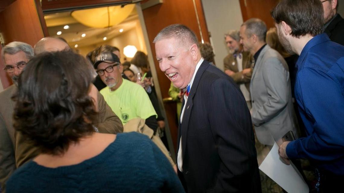 A.J. Balukoff laughs with attendees of a Democratic election night party in November 2014 at The Grove Hotel in Boise.