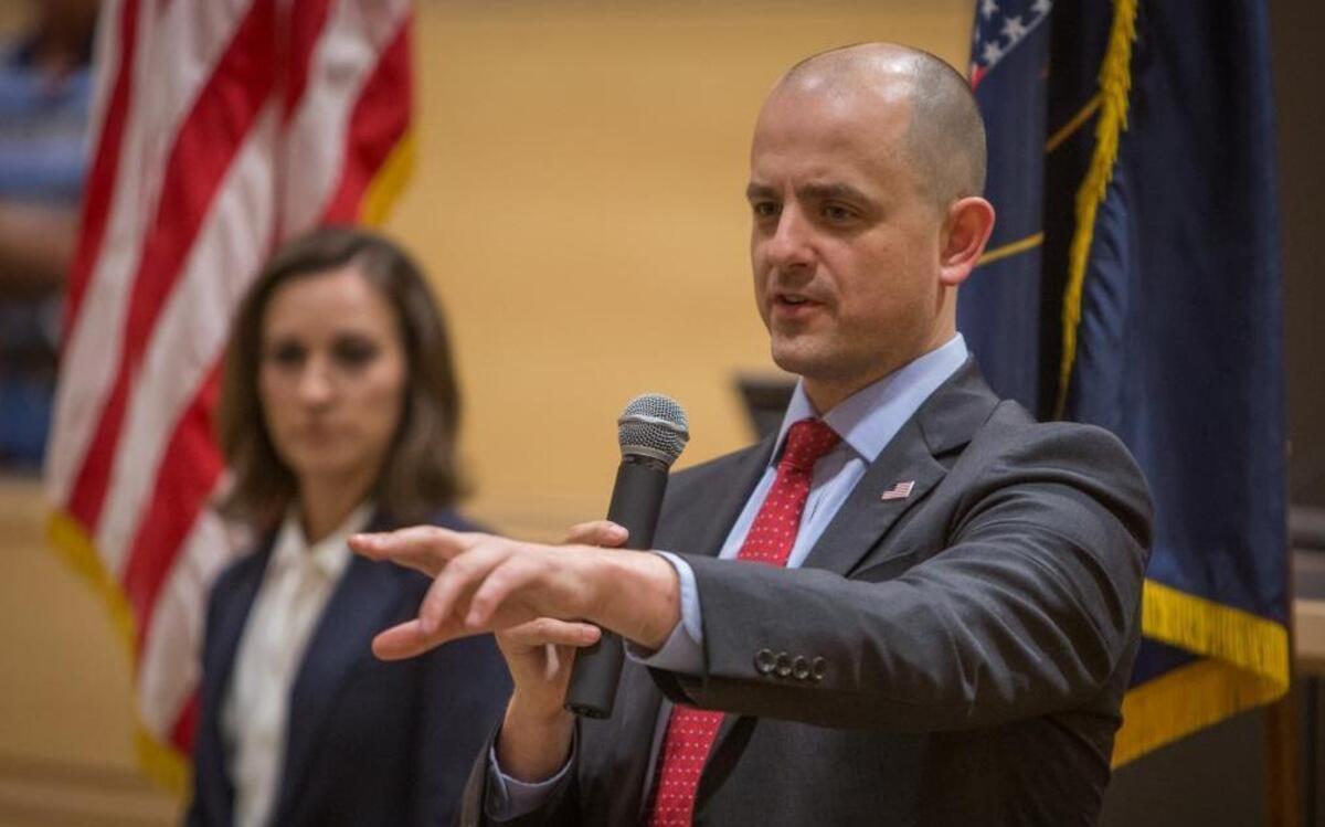 Evan McMullin answer questions from voters at an Oct. 13 town hall meeting in Syracuse, Utah. The independent candidate for president also used the event to introduce his running mate, Mindy Finn, at left.