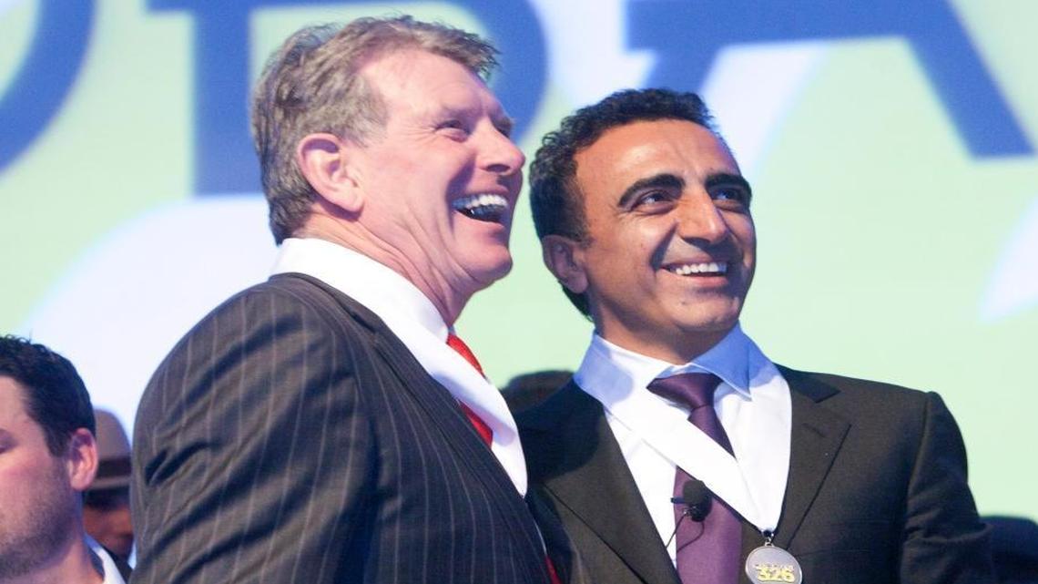 Gov. Butch Otter, left, and Hamdi Ulukaya, founder, president and CEO of Chobani, sport medals commemorating the grand opening of Chobani’s Twin Falls manufacturing plant in this December 2012 file photo.