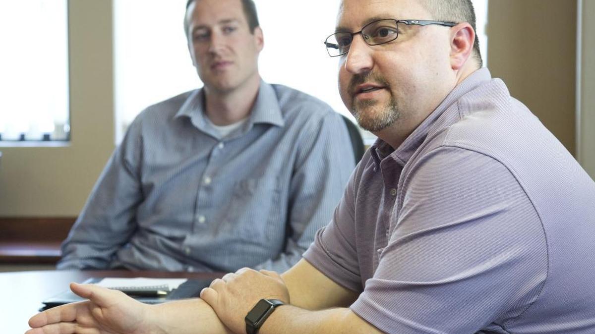 Travis Schaat, left, and Chris Priest are two former state employees who were dismissed from the treasurer’s office. Priest is suing for wrongful dismissal.