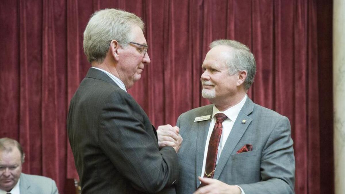An emotional Sen. Bob Nonini, R-Coeur d’Alene, left, and Sen. Marv Hegedorn, R-Meridian, say their farewells as the Senate adjourns. Both will not be returning next year – and both are candidates for lieutenant governor.