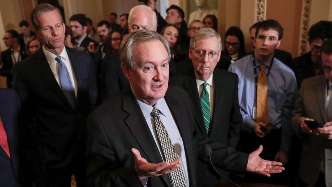 Sen. Mike Crapo, R-Idaho and chairman of the Senate Banking Committee, and other Senate leaders talk to reporters March 6, 2018, as the Senate weighed legislation to roll back some of the safeguards Congress put in place to prevent a repeat of the 2008 financial crisis.