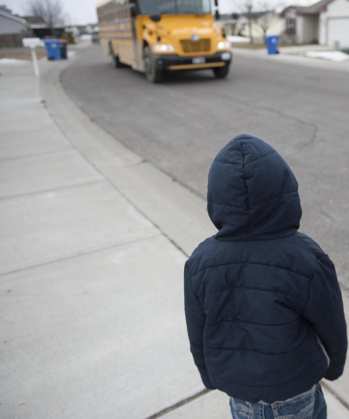 A 6-year-old boy in foster care gets ready to go to school March 6, 2017, in Twin Falls.