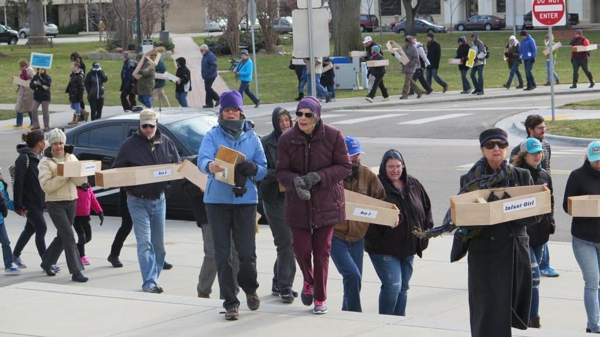 Protesters carried 183 symbolic child-sized coffins to the Idaho Capitol steps in February 2018, calling for Idaho to repeal its faith-healing exemption. That law allows parents to deny their children medical care without civil or criminal liability, even if the children die.