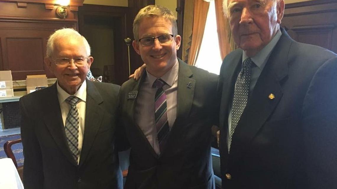 State Rep. Mat Erpelding, D-Boise, center, with former Idaho governors Phil Batt, left, and Cecil Andrus, right, at the Idaho Statehouse.