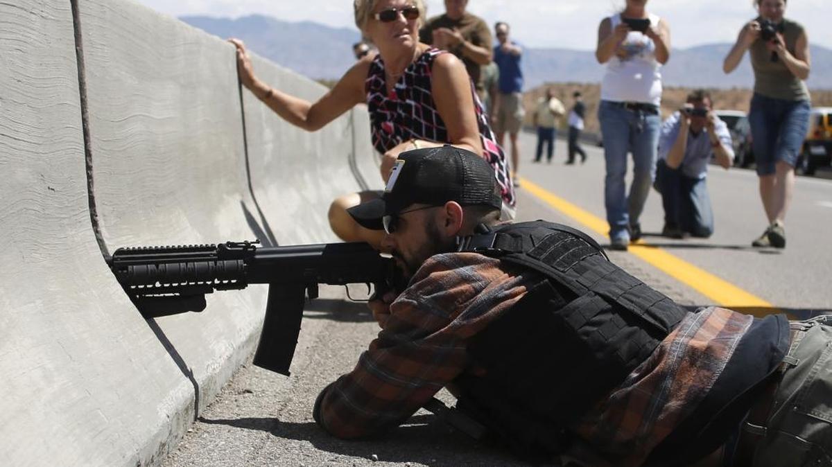 Protester Eric Parker from Hailey aims his weapon from a bridge next to the Bureau of Land Management's base camp, where seized cattle belonging to rancher Cliven Bundy were being held near Bunkerville, Nevada, April 12, 2014.