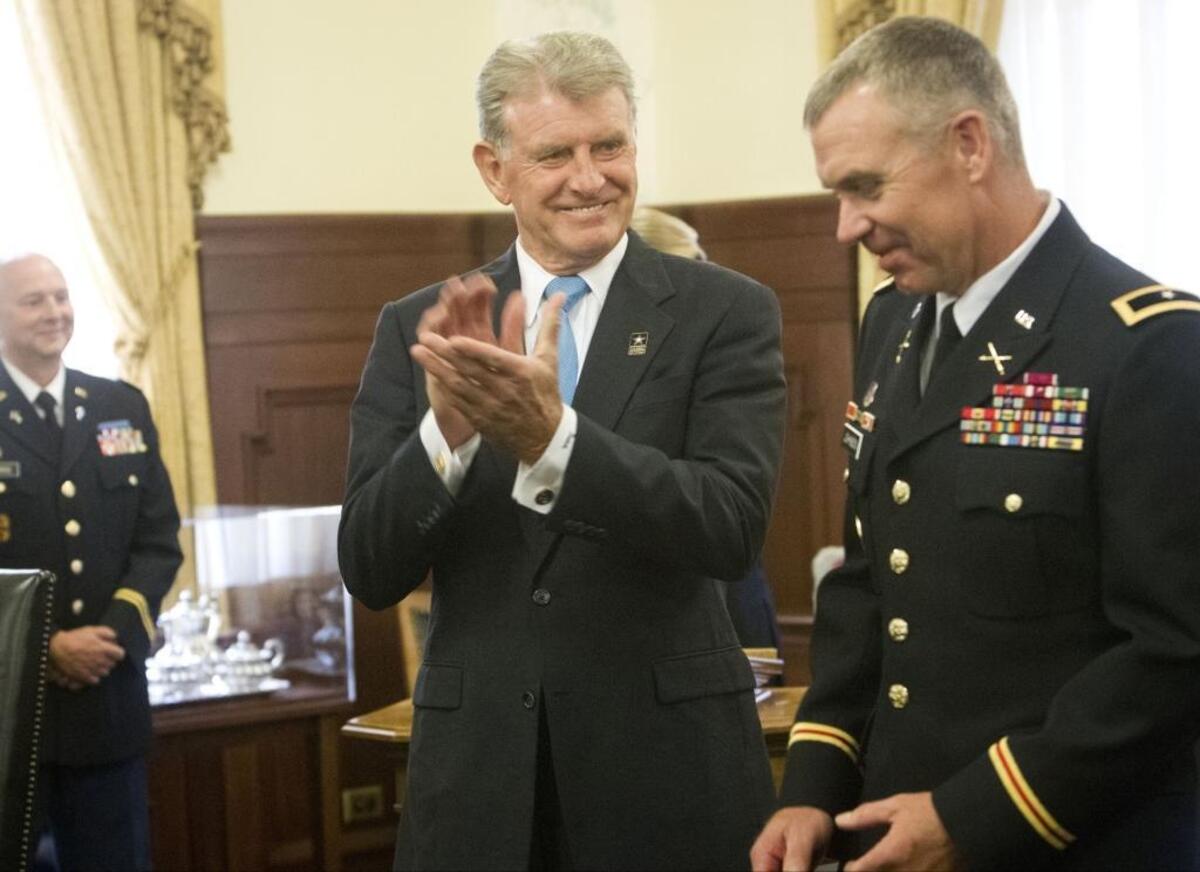 Among the activities in his first full week back to work, Gov. Butch Otter presided over a pinning ceremony Tuesday promoting Idaho Army National Guard Col. Russel Johnson to the rank of brigadier general.