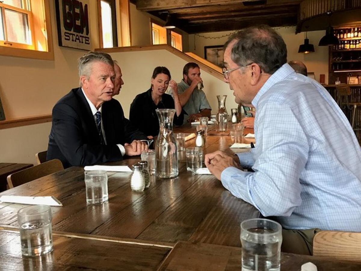 Lt. Gov. Brad Little, left, talks with Stanley Mayor Herb Mumford over lunch at the Stanley Sluice during “Capital for a Day” on Aug. 11, 2017.