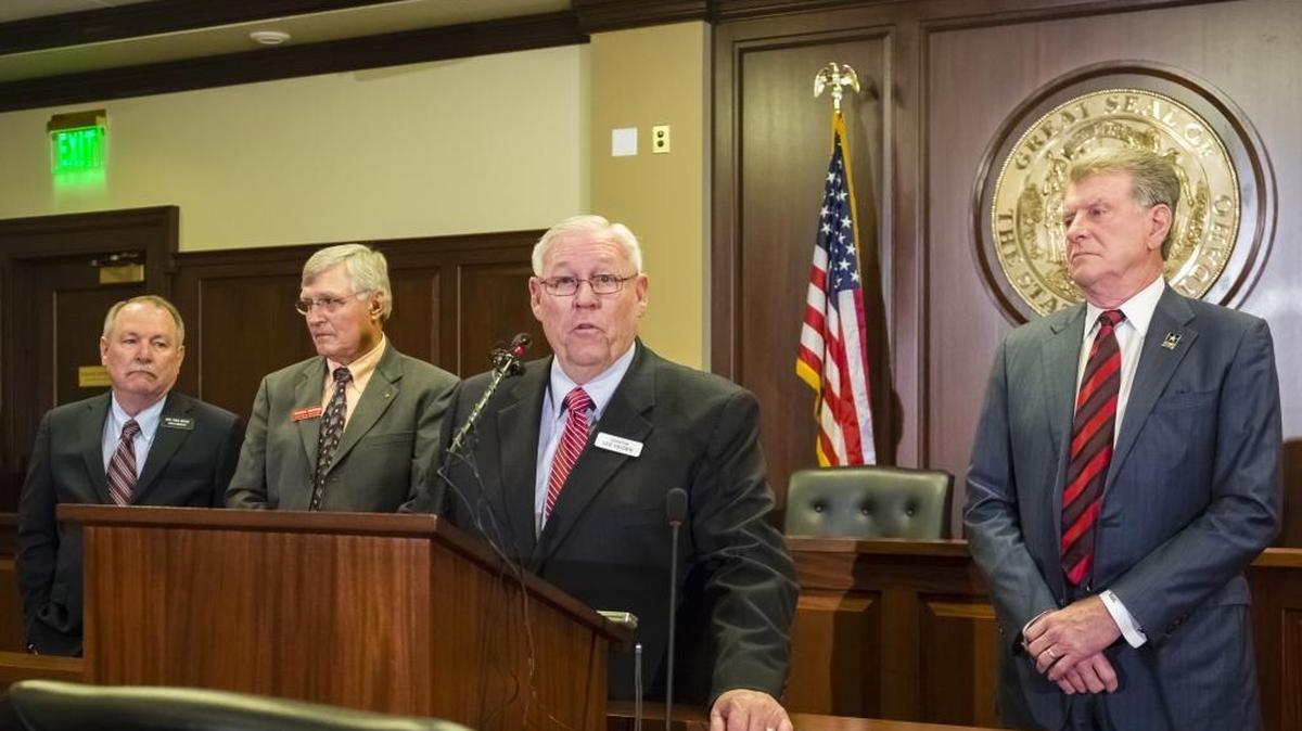 Sen. Lee Heider, R-Twin Falls, speaks on the proposed Idaho Primary Care Access Program in early January. With him from left are Rep. Fred Wood, R-Burley; Health & Welfare Department Director Richard Armstrong, and Gov. Butch Otter. (AP Photo/Otto Kitsinger)