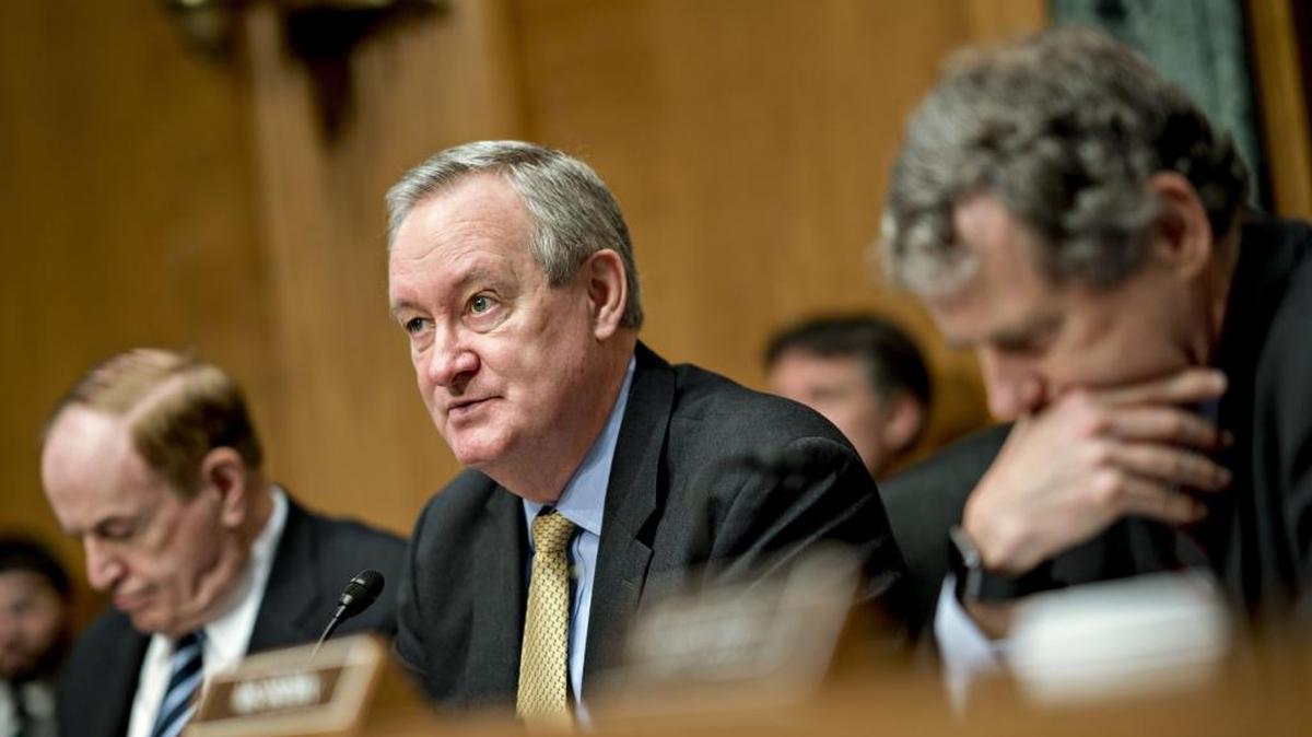 At center: Sen. Mike Crapo, R-Idaho, chairman of the Senate Banking, Housing and Urban Development Committee, speaks at a hearing in Washington, D.C., on Feb. 6, 2018.