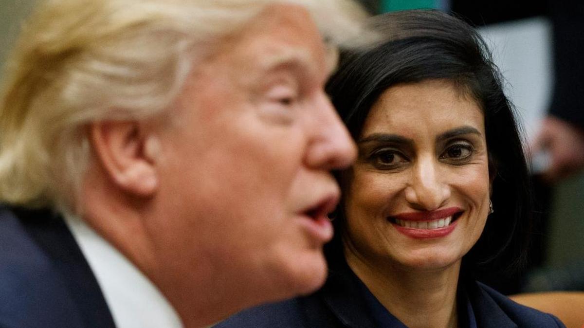 In this March 22, 2017 photo, Seema Verma, administrator of the Centers for Medicare and Medicaid Services, listens at right as President Donald Trump speaks during a March 2017 meeting at the White House. Work requirements for Medicaid could lead to major changes in the social safety net under Trump. The question: Should adults who are able to work be required to do so to get taxpayer provided health insurance?