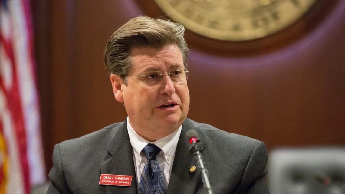 Dean Cameron, director of the Idaho Department of Insurance, speaks to reporters Jan. 5 about a health insurance executive order.