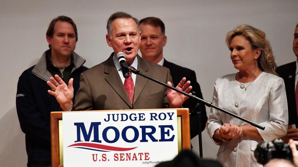 U.S. Senate candidate Roy Moore speaks as his wife Kayla Moore looks on at the end of an election-night watch party Tuesday, Dec. 12, 2017, in Montgomery, Ala.