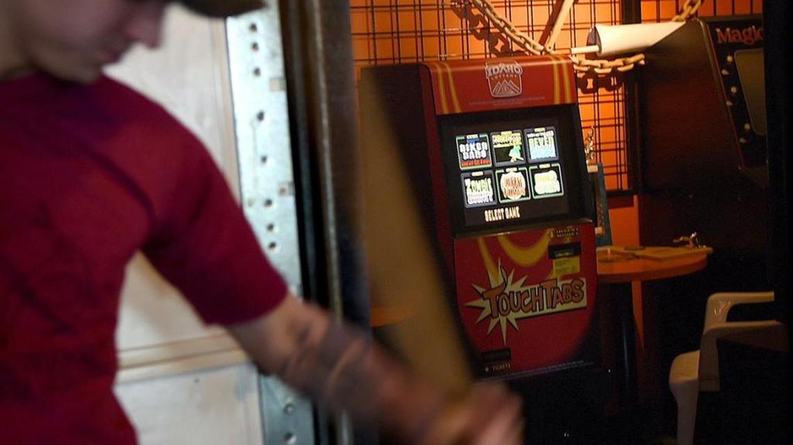 Cruiser's Bar & Grill bartender Laneith Veo talks about the popularity of the Idaho Lottery's "touch tab" vending machines Thursday at the bar in Stateline.