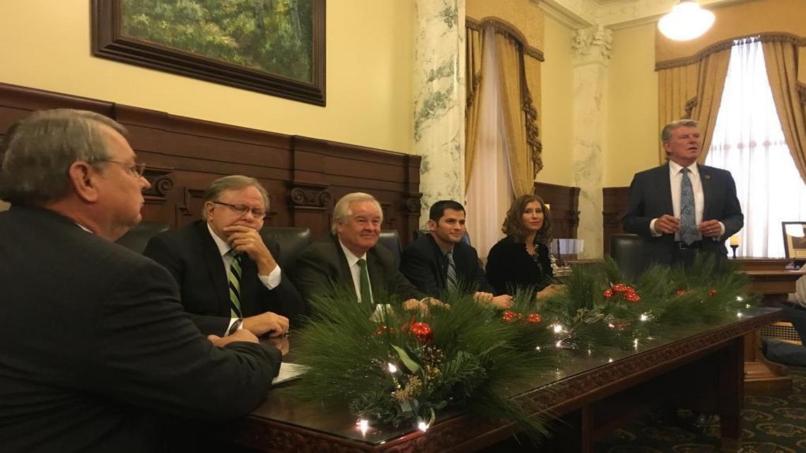 Idaho Secretary of State Lawerence Denney, at left, and Gov. Butch Otter flank Idaho’s presidential electors, from left: Rod Beck, Skip Smyser, Caleb Lakey and Jennifer Locke.