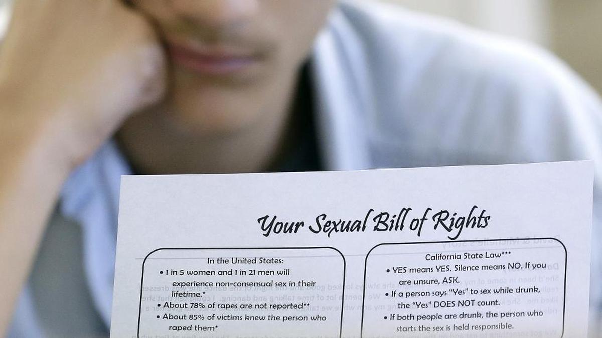 A student reads along with classmates during a ninth-grade sex education class in October 2015 in California.