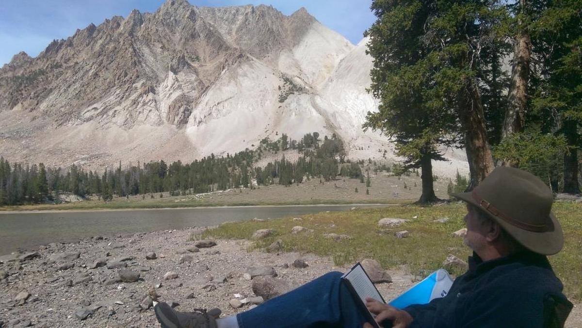 Idaho Republican Rep. Mike Simpson looks at Castle Peak from his campsite in the Chamberlain Basin within the White Clouds Wilderness, during a trip after the wilderness’ creation.