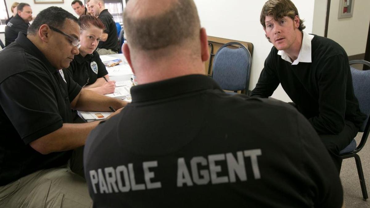 Idaho probation and parole officers Casey Fatzinger, right, and Josh Redford, left, are shown during a role-play training session in this Feb. 2, 2015, file photo.