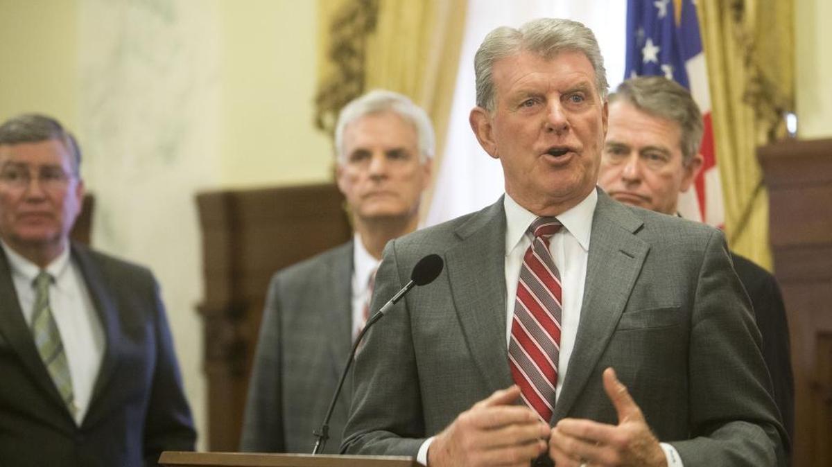 Gov. Butch Otter speaks following the 2017 legislative session. Behind him, from left, are House Speaker Scott Bedke, Senate Pro Tem Brent Hill and Lt. Gov. Brad Little.