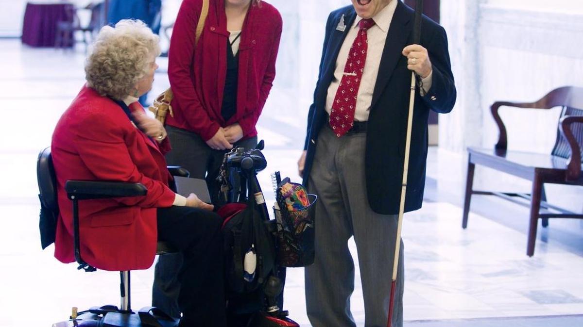 Fred Riggers, enjoys a brief conversation at the Statehouse March 7, 2013. Riggers, is a fixture at the Statehouse during the Idaho Legislative session, greeting everyone and even directing traffic for visitors looking for the right committee meeting.